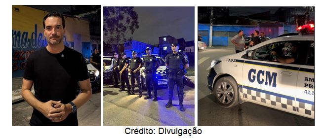 A imagem é um conjunto de três fotos dispostas lado a lado. Todas as fotos parecem ter sido tiradas à noite.  Na foto da esquerda, um homem de pele clara e cabelos escuros, usando óculos e uma camiseta preta, posa olhando para a câmera com as mãos cruzadas na frente do corpo. Ao fundo, parcialmente desfocado, há um letreiro com letras brancas em um fundo escuro, com parte da palavra "na-de" visível.  A foto do meio mostra um grupo de cinco homens uniformizados, provavelmente policiais ou agentes de segurança, em pé lado a lado em uma rua escura. Eles estão usando uniformes escuros e parecem estar em patrulha. Há viaturas policiais com luzes azuis piscando ao fundo.  A foto da direita mostra uma viatura policial branca com detalhes em azul e preto, estacionada na rua. A lateral da viatura está com a inscrição "GCM" em letras grandes e azuis, e abaixo, em letras menores, "AM PR ALI". Há pessoas ao redor da viatura, algumas em pé e outras conversando. As luzes da viatura estão piscando, indicando uma ocorrência policial.  No centro da parte inferior das três fotos, há a inscrição "Crédito: Divulgação" em letras menores e cinzas.  O contexto geral das fotos sugere uma ação policial ou de segurança pública, possivelmente relacionada a uma operação ou patrulha noturna. As legendas em português na imagem indicam que as fotos podem estar relacionadas a relatos de moradores sobre a segurança em uma determinada região, mencionando a melhora na qualidade de vida devido ao trabalho policial.
